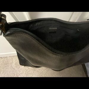 Black leather purse w/zipper and inside pocket.